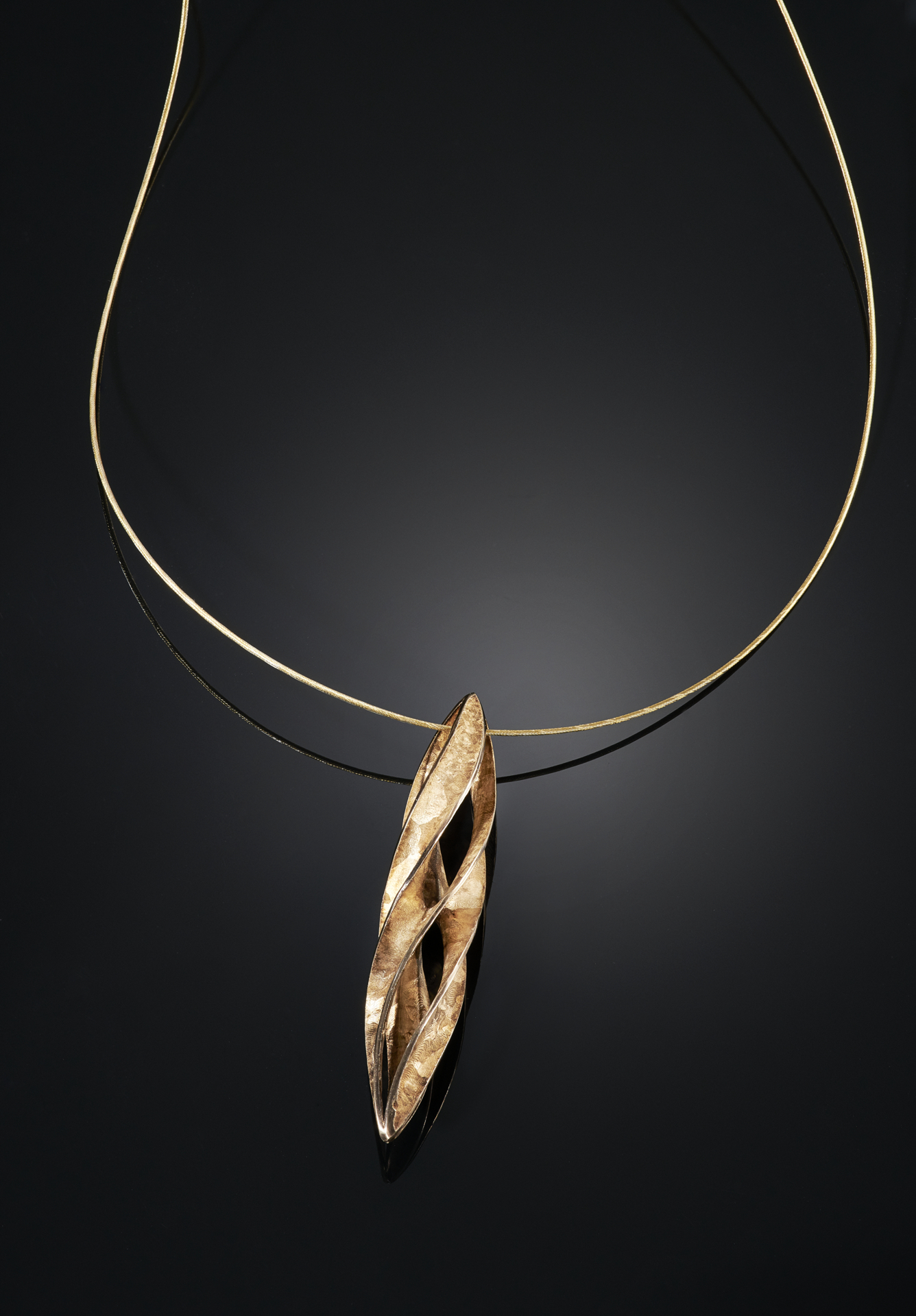 gold-over-cast-crystalline-bronze-enneper-twist-pendant